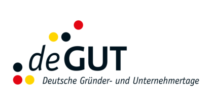 Logo der Deutschen Gründer- und Unternehmertage. Schwarze Schrift und schwarze, rote und goldene Punkte.