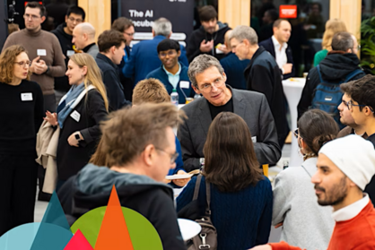 Netzwerksituation mit Akteurinnen und Akteuren der Cyber Valley Community. Unten links sind bunte Grafikelemente vom Cyber Valley als Layover angebracht. Bildrechte: Cyber Valley.