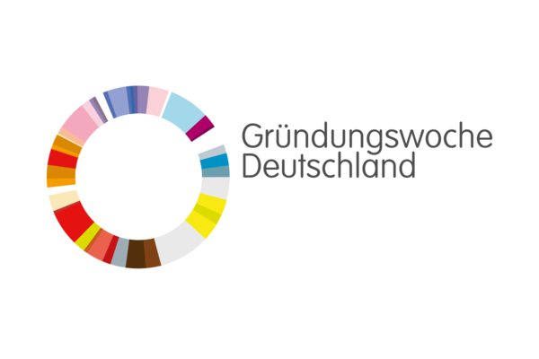 Logo Gründungswoche Deutschland. Bunter Kreis und graue Schrift "Gründungswoche Deutschland" auf weißem Hintergrund.